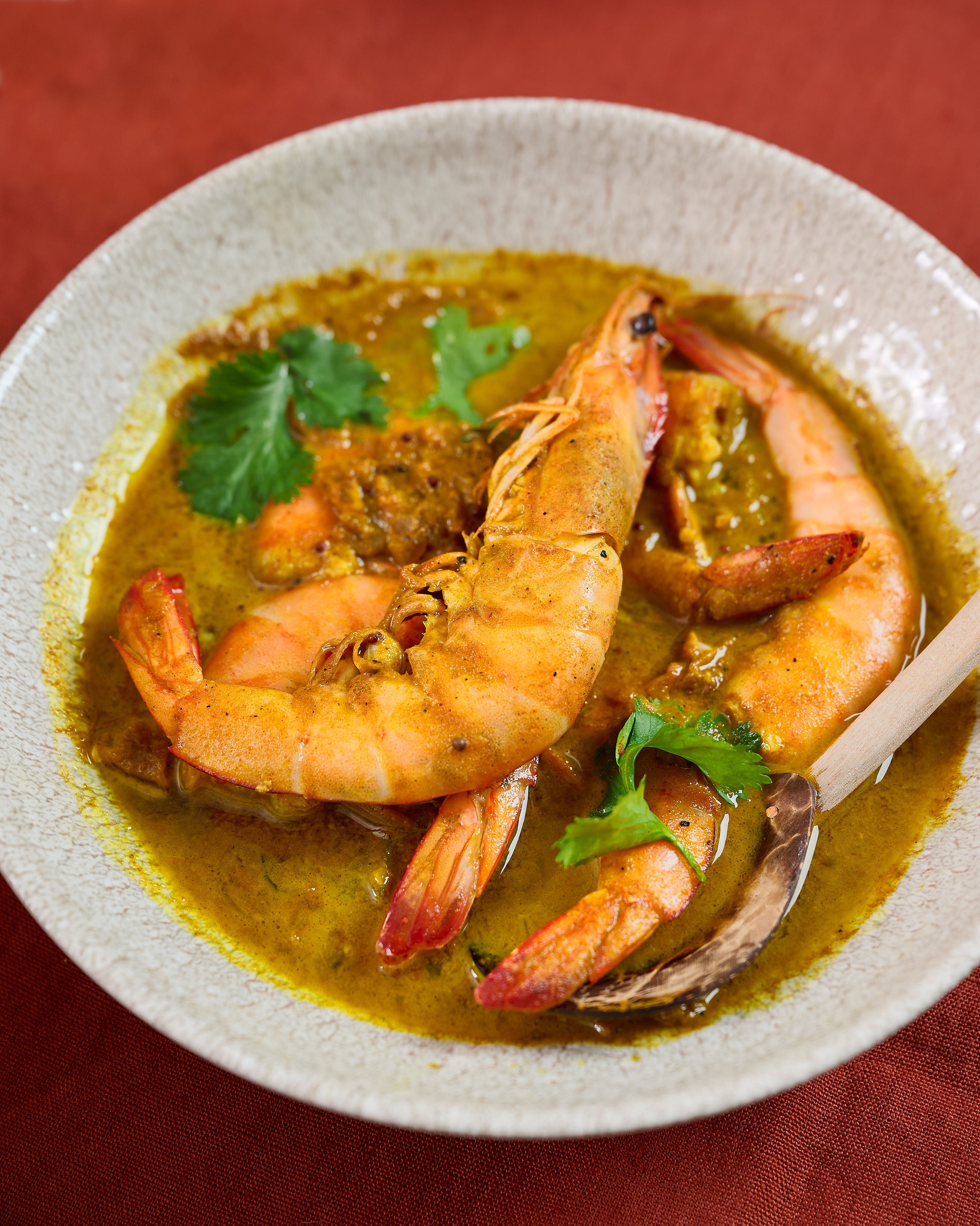 A plate full of prawn curry made with the Sri Lankan prawn curry kit packet 