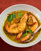 A plate full of prawn curry made with the Sri Lankan prawn curry kit packet 