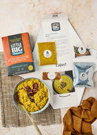 Open Red Lentil Curry Kit beside a cooked Sri Lankan red lentil curry